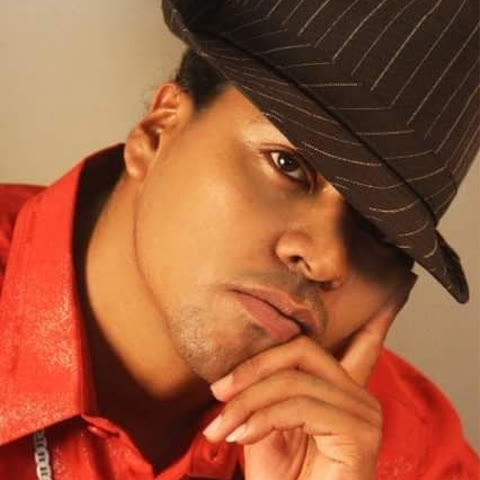 Freddie Lee Hare Jr. in a red shirt and pinstripe hat